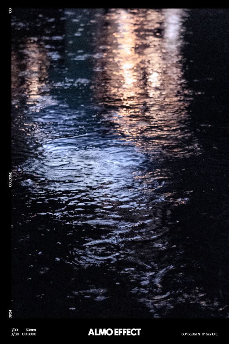 On a rainy day at which one would rather stay at home than going outside, we capture the lights of a bar in a big puddle. After looking a while at it, the puddle and the reflecting lights began an interesting play of colors and movement, because it was still raining. Even if it was freaking wet and we have fear for our camera equipment because of the rain, we were happy to have made the decision to capture that moment.